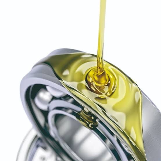 Oil pouring over a set of bearings.